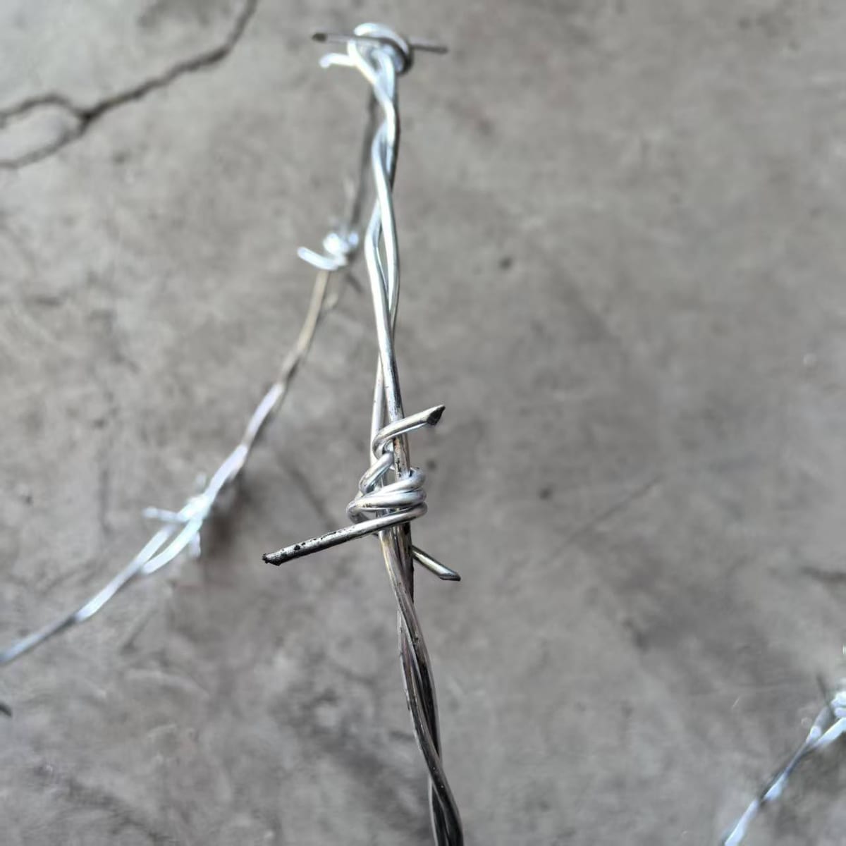 Galvanized barbed wire roll in factory